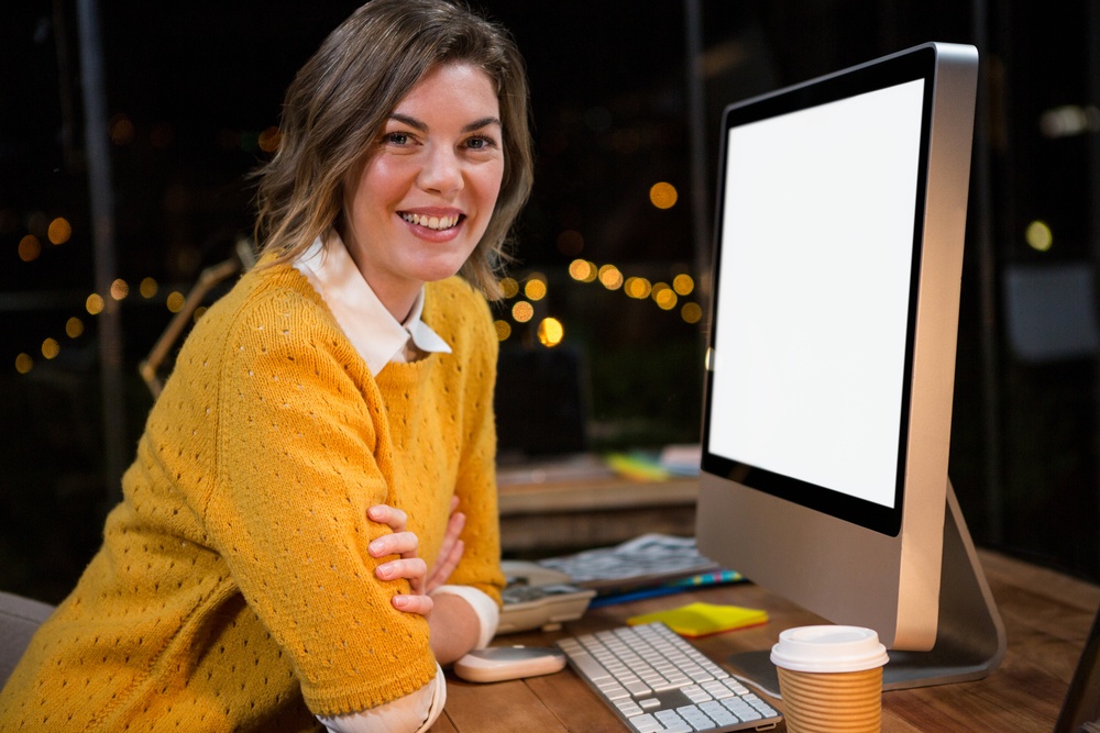 Portrait of businesswoman sitting at her desk in the office